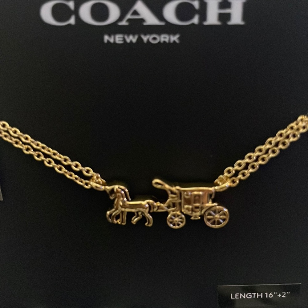 Coach gold double strand horse and carriage necklace.